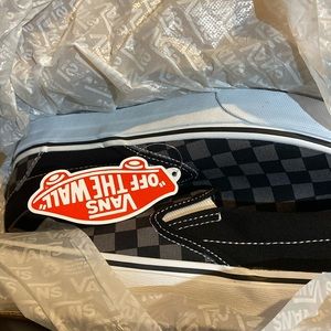 Classic slip on black and grey vans.